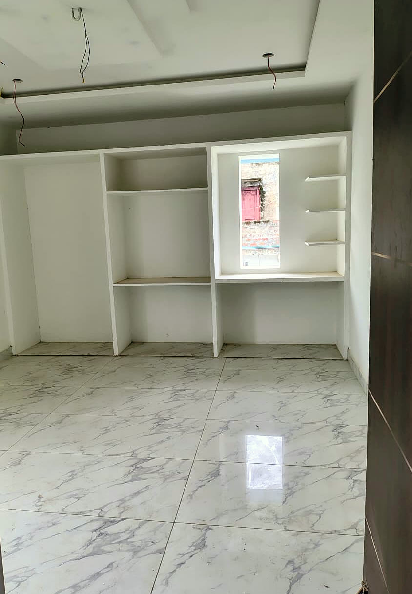 Bedroom with built-in designer wardrobe shelves